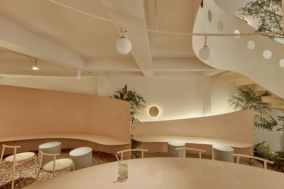 September Cafe is designed to look like a bird's nest with curved steel stripes in Vietnam