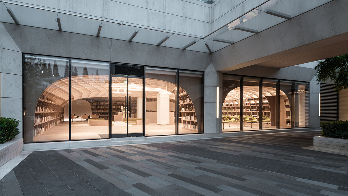 Wutopia Lab wraps the interior of a neighborhood center with wood-like aluminum panels