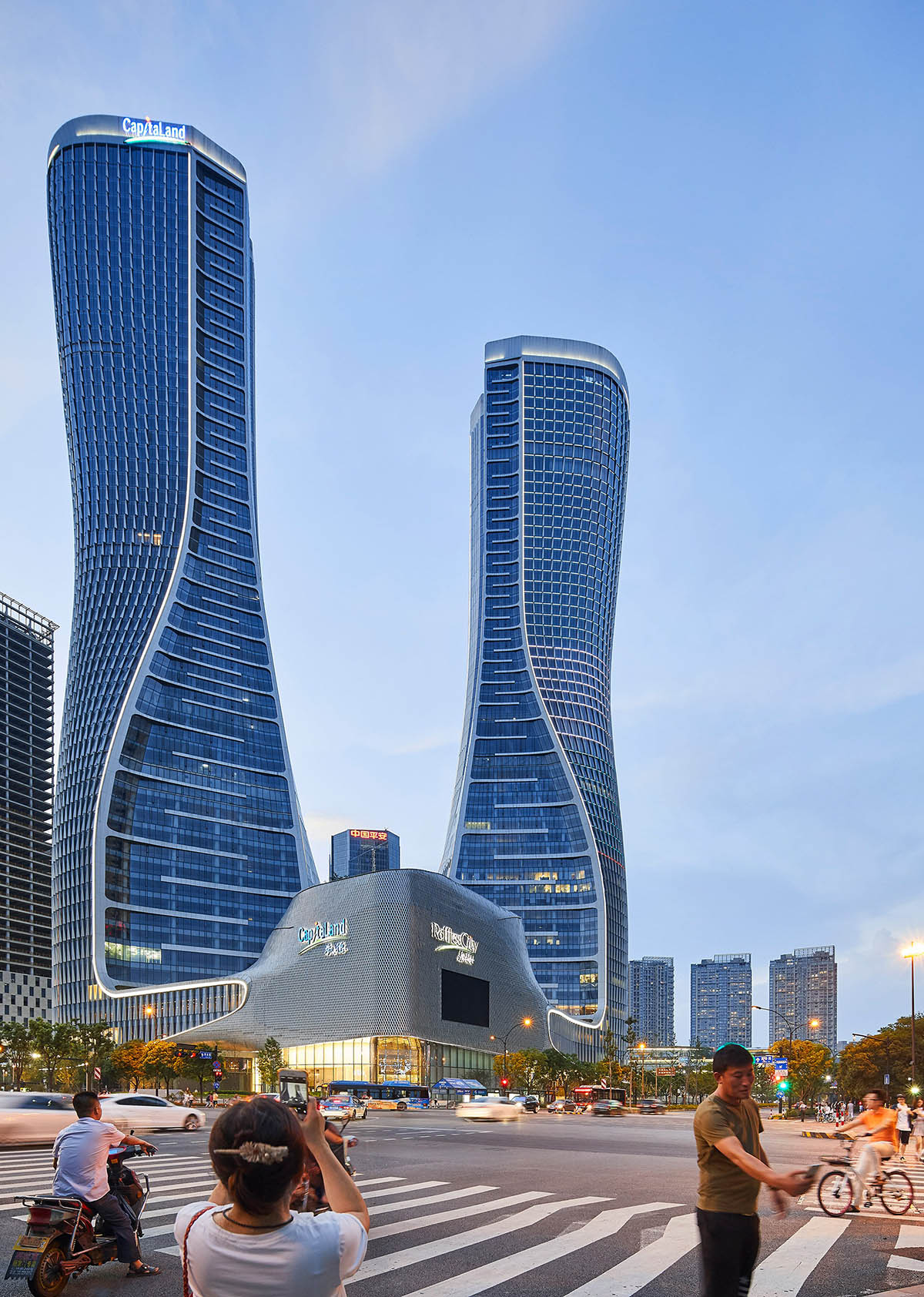 UNStudio completed Raffles City complex with twisted towers in Hangzhou