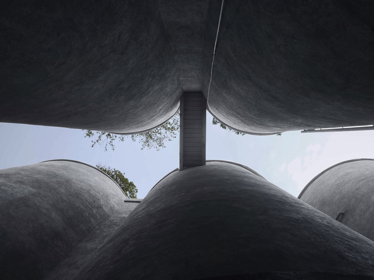 Ten towering cylindrical cement silos are converted to house immersive library of books in China