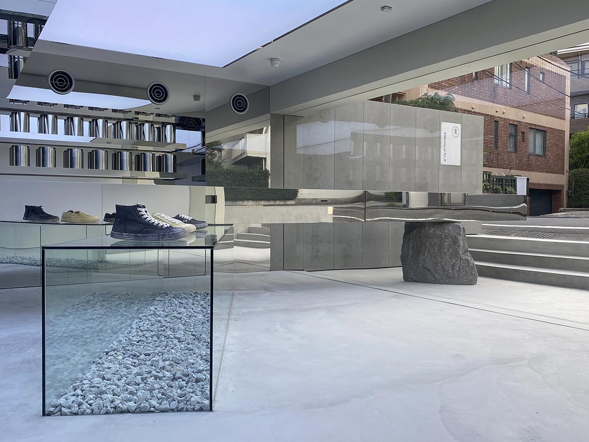 Mirrored boxes and reflective surfaces create multifaceted perspectives in a Tokyo shop