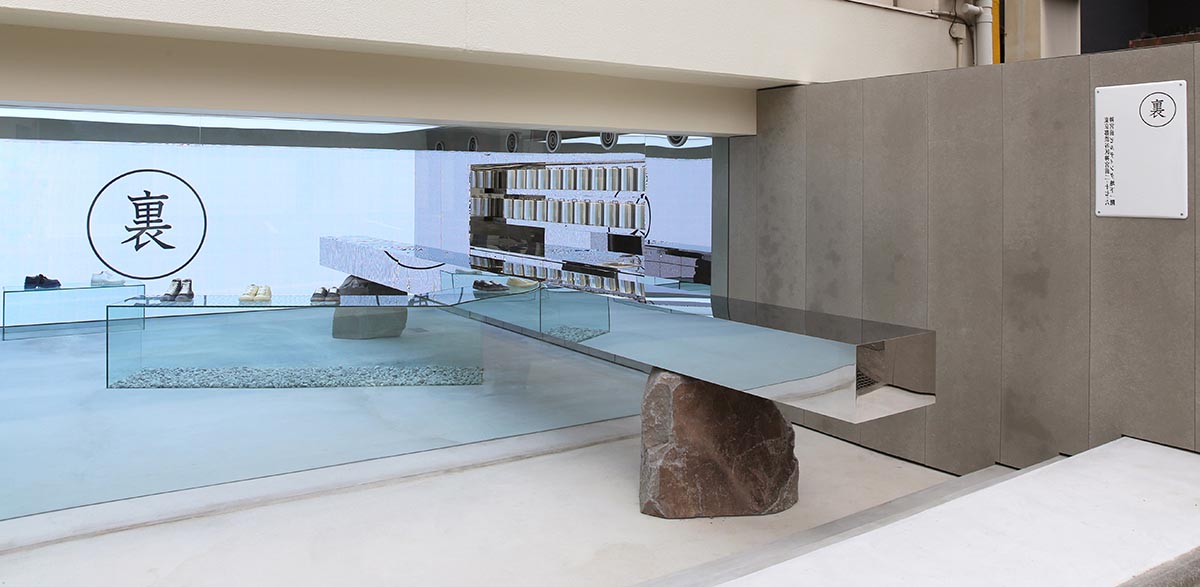 Mirrored boxes and reflective surfaces create multifaceted perspectives in a Tokyo shop