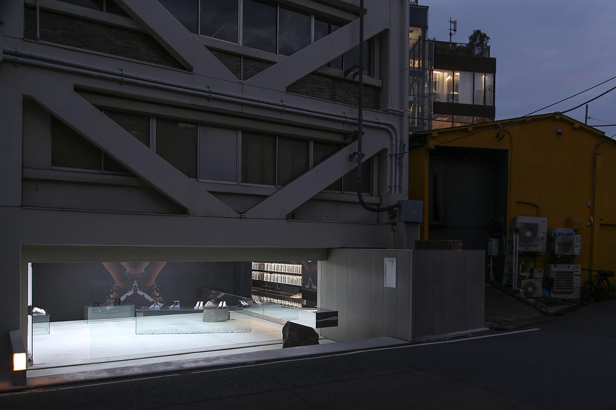 Mirrored boxes and reflective surfaces create multifaceted perspectives in a Tokyo shop