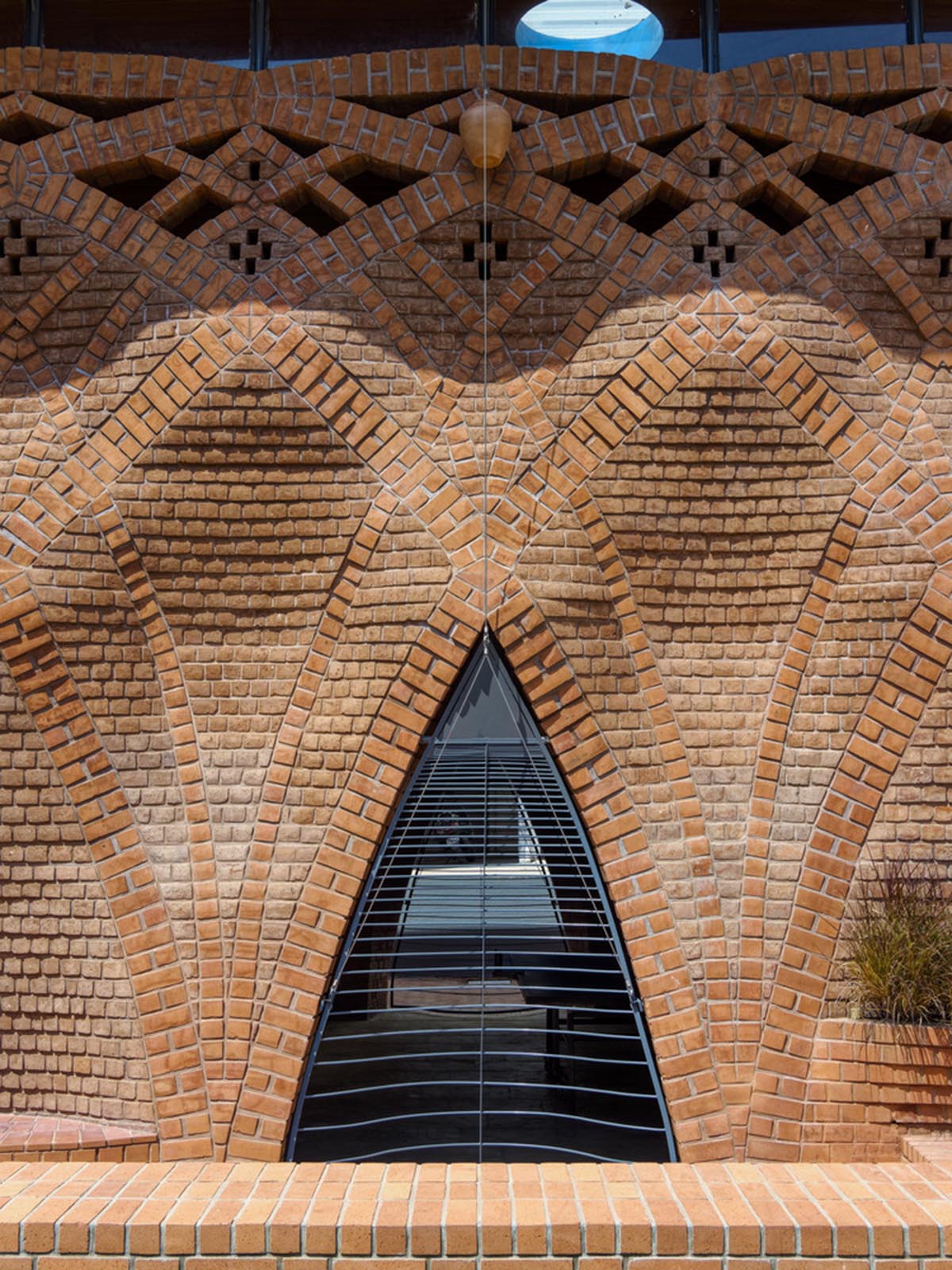 PMA madhushala's community center features undulating and artistic brick walls in Pune