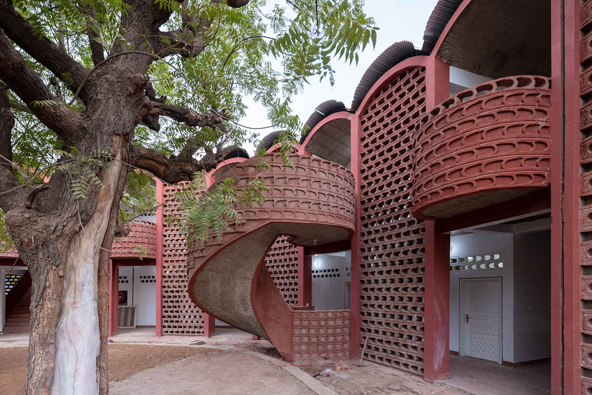 Manuel Herz Architects built curvilinear hospital with lattice-like brickwork in rural Senegal