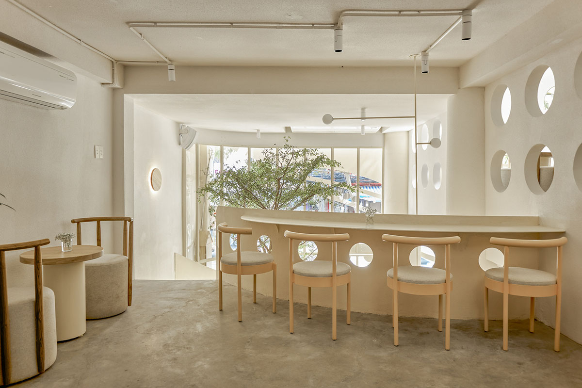 September Cafe is designed to look like a bird's nest with curved steel stripes in Vietnam