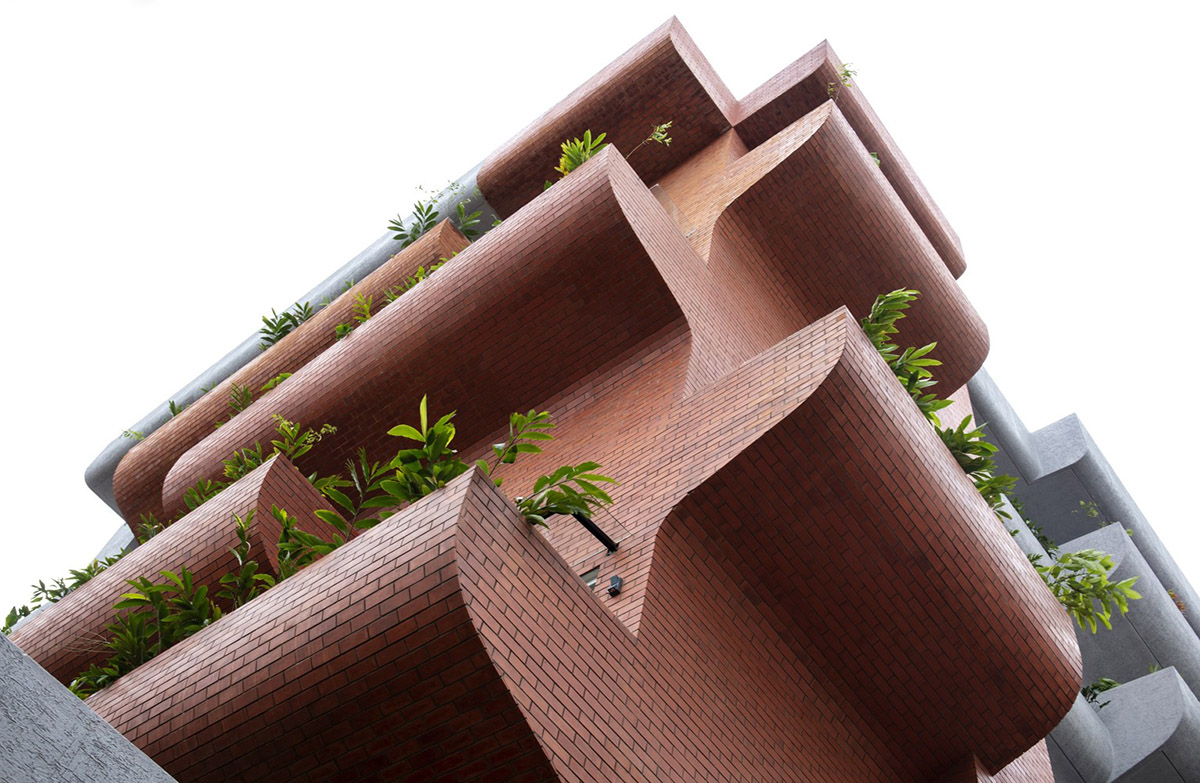 Fluid balconies for this housing help plants to grow comfortably designed by The Purple Ink Studio