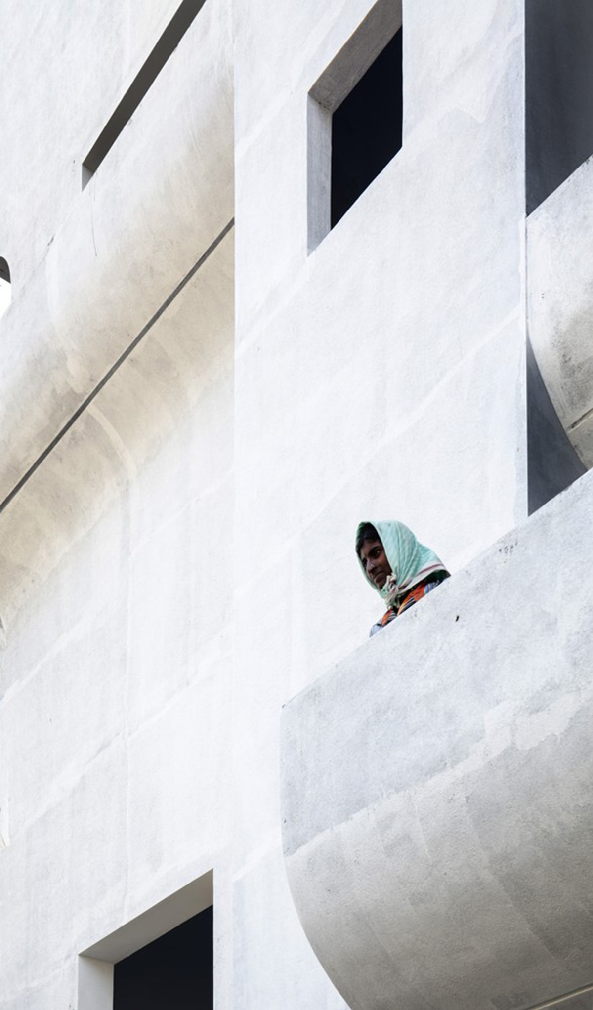 Fluid balconies for this housing help plants to grow comfortably designed by The Purple Ink Studio