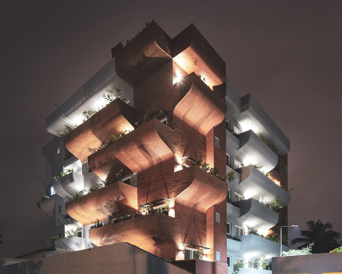 Fluid balconies for this housing help plants to grow comfortably designed by The Purple Ink Studio