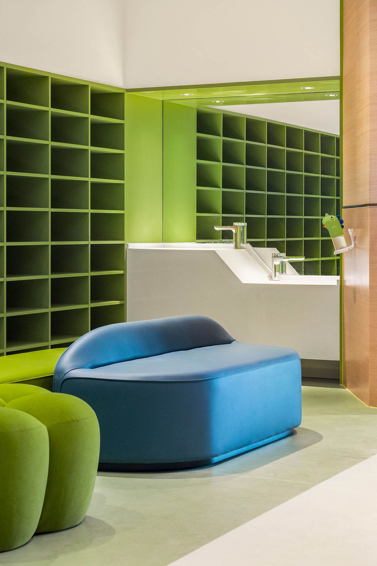 Children's entertainment area by Mind Design mimics green jungle with curvy climbing net in Ningxia 