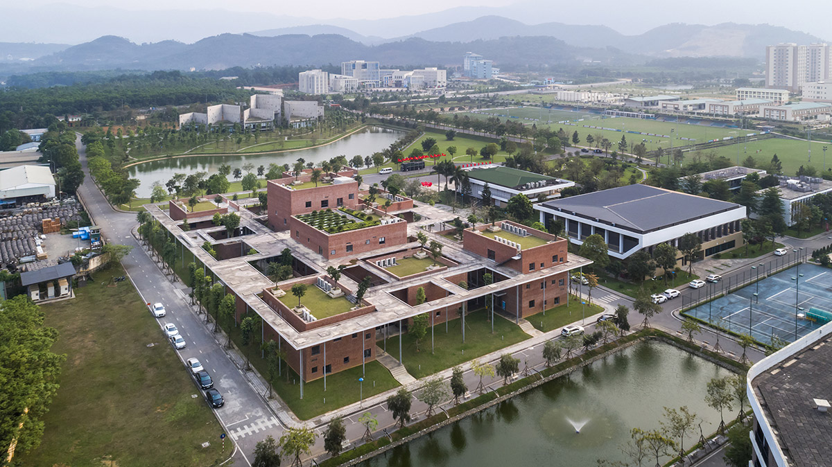 Multi-level circulation paths and gardens activate VTN Architects' Educational Center in Hanoi