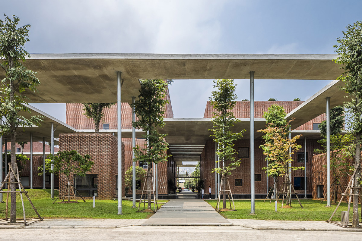 Multi-level circulation paths and gardens activate VTN Architects' Educational Center in Hanoi