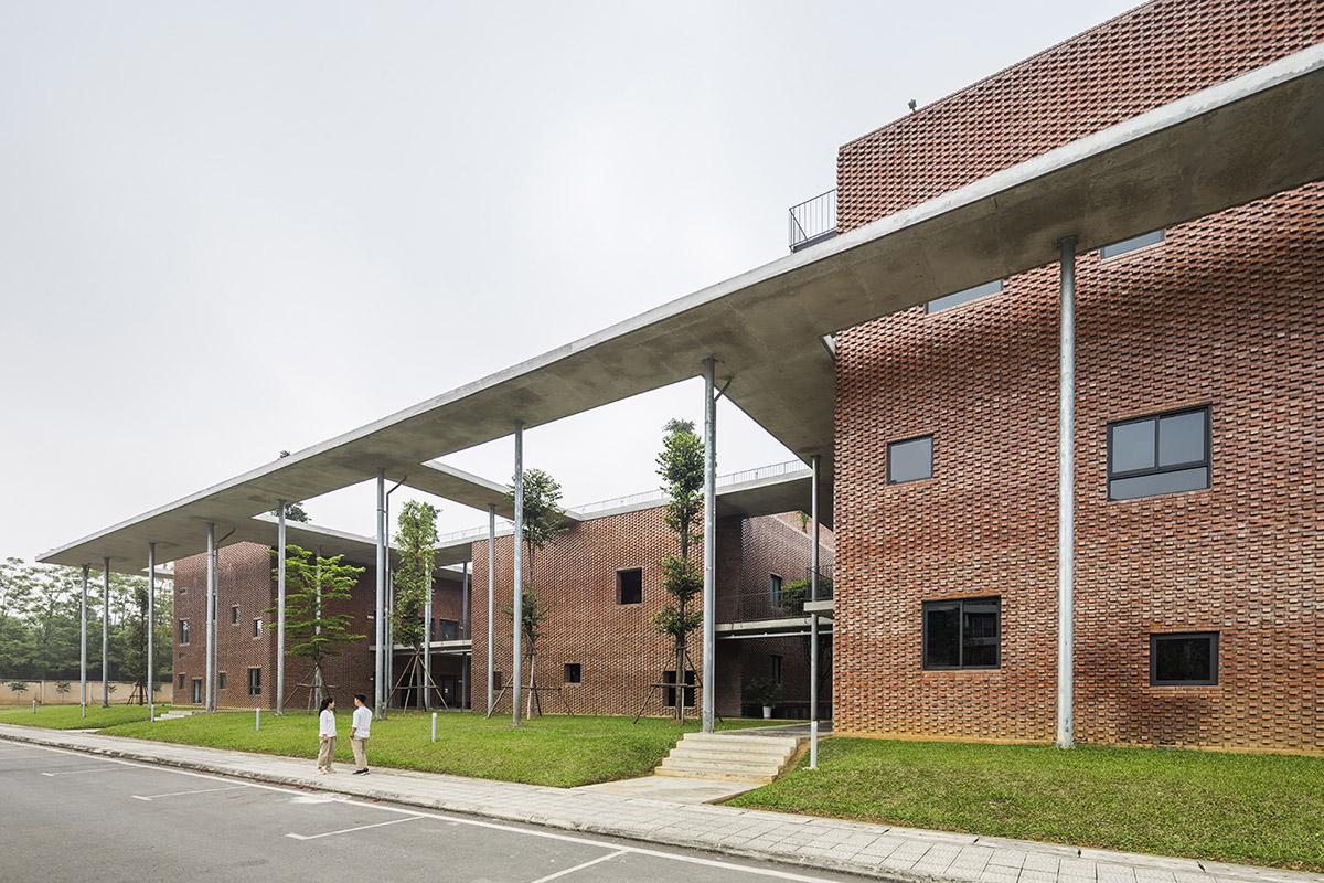 Multi-level circulation paths and gardens activate VTN Architects' Educational Center in Hanoi