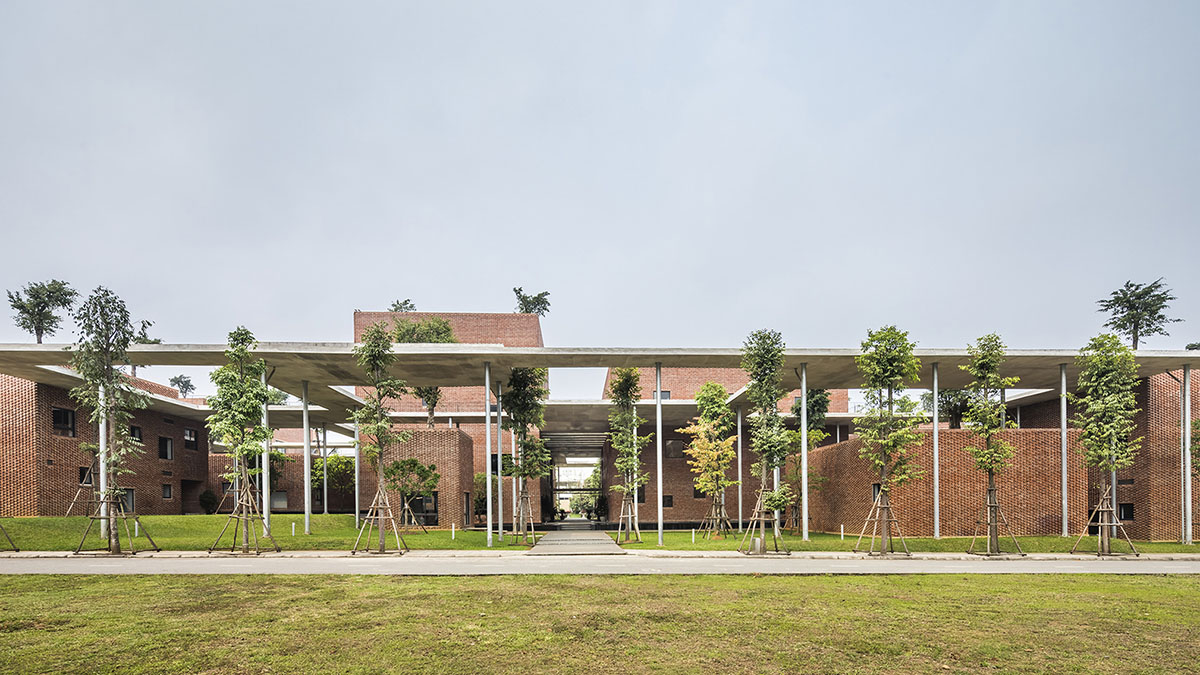 Multi-level circulation paths and gardens activate VTN Architects' Educational Center in Hanoi