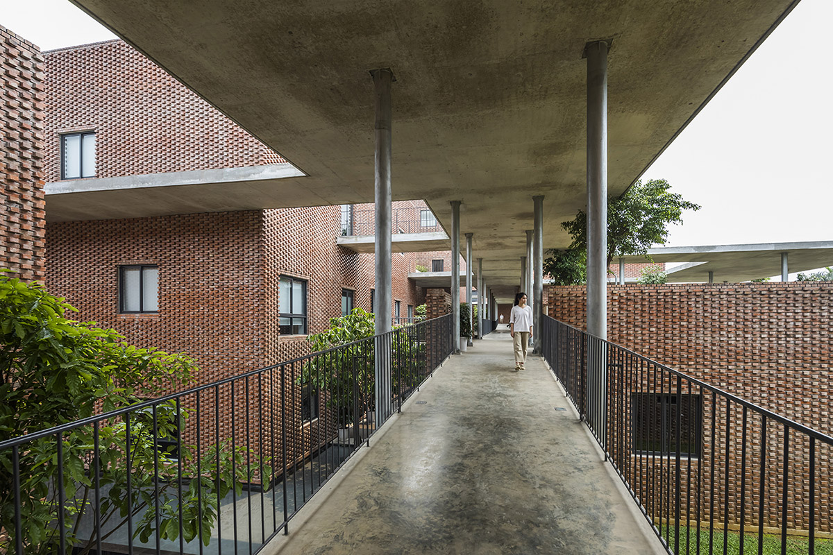 Multi-level circulation paths and gardens activate VTN Architects' Educational Center in Hanoi