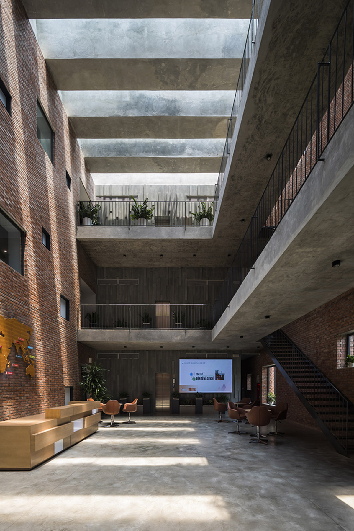 Multi-level circulation paths and gardens activate VTN Architects' Educational Center in Hanoi