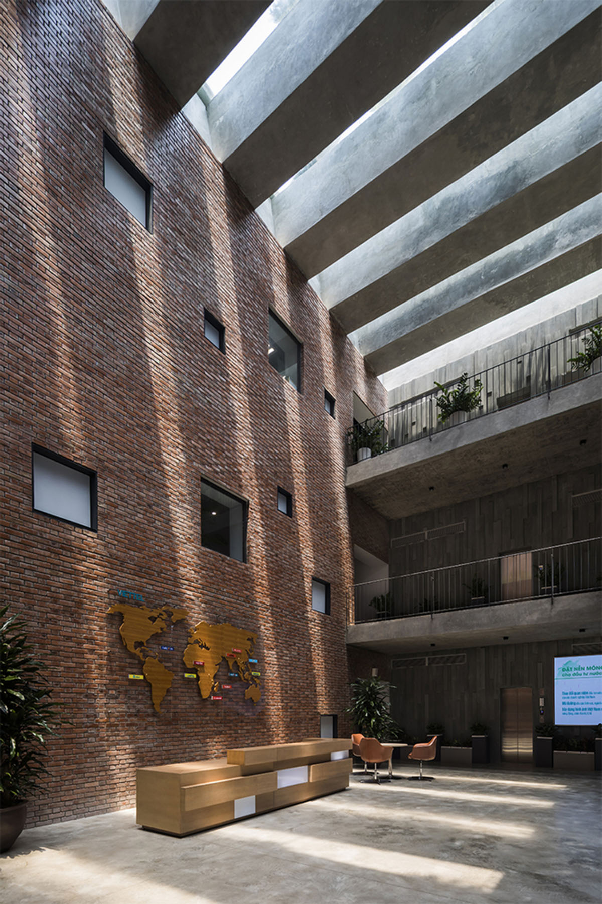 Multi-level circulation paths and gardens activate VTN Architects' Educational Center in Hanoi