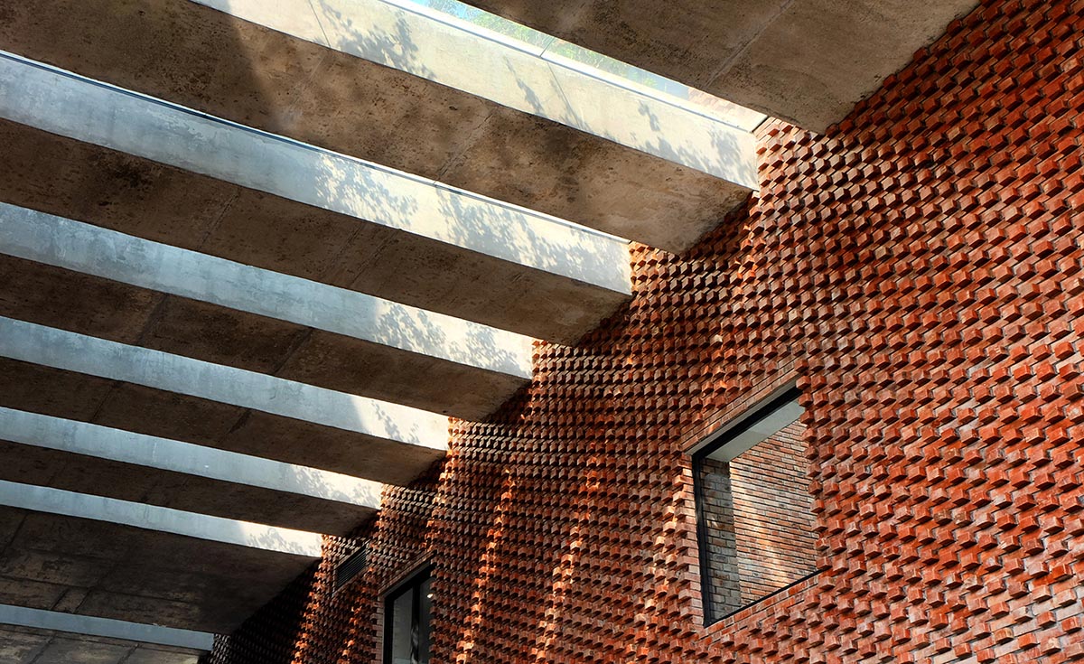 Multi-level circulation paths and gardens activate VTN Architects' Educational Center in Hanoi