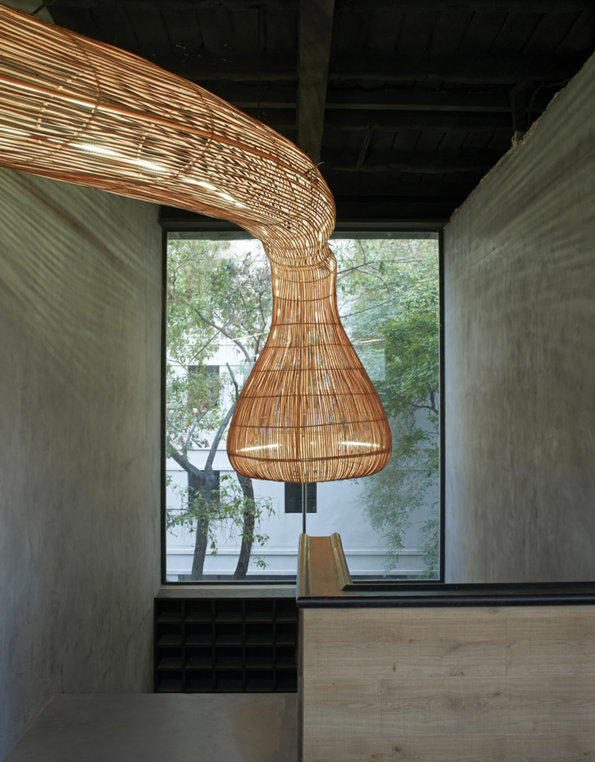 Free form wooden pods wrap the interior of yoga space in Bangkok designed by Enter Projects Asia