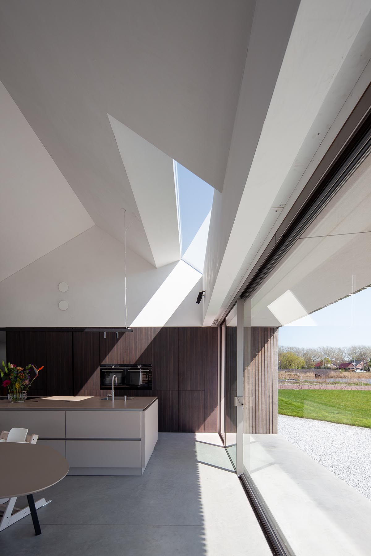 Francois Verhoeven Architects built wood-frame family house with sloped roof in the Netherlands
