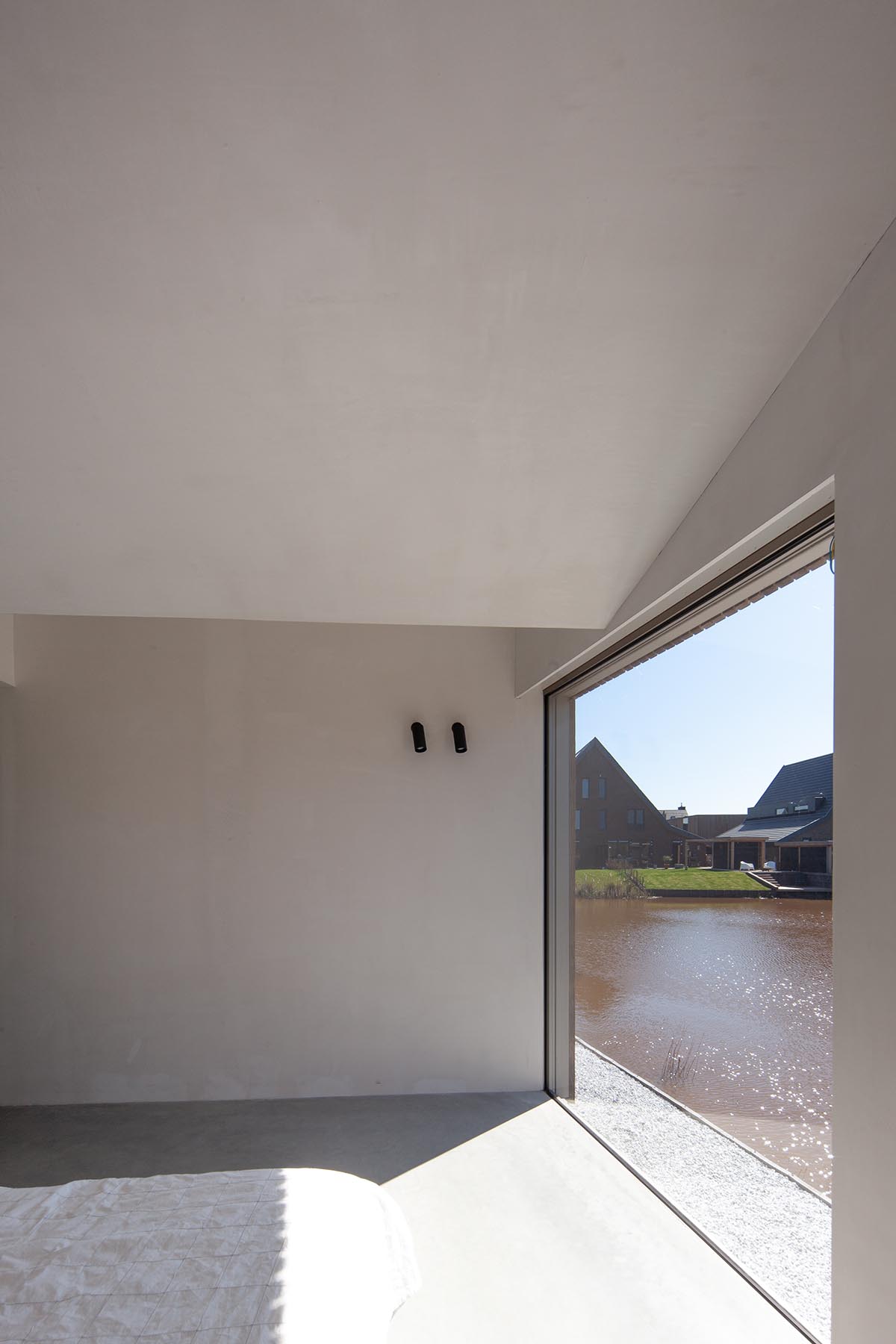 Francois Verhoeven Architects built wood-frame family house with sloped roof in the Netherlands