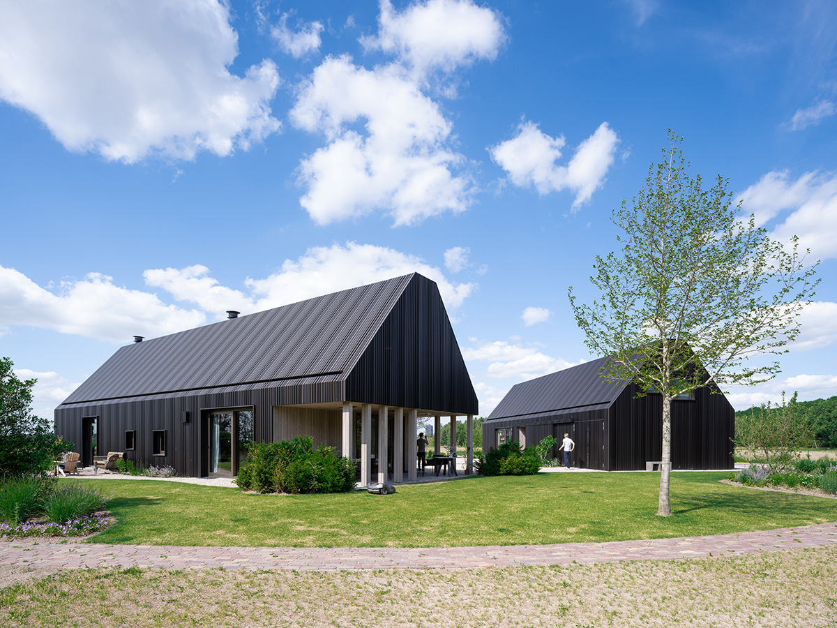 Mecanoo completes Villa Vught with dark bronze cladding inspired by traditional Dutch farmhouses