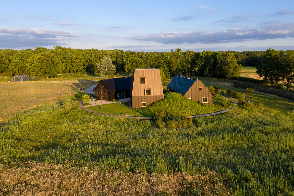 Mecanoo completes Villa Vught with dark bronze cladding inspired by traditional Dutch farmhouses