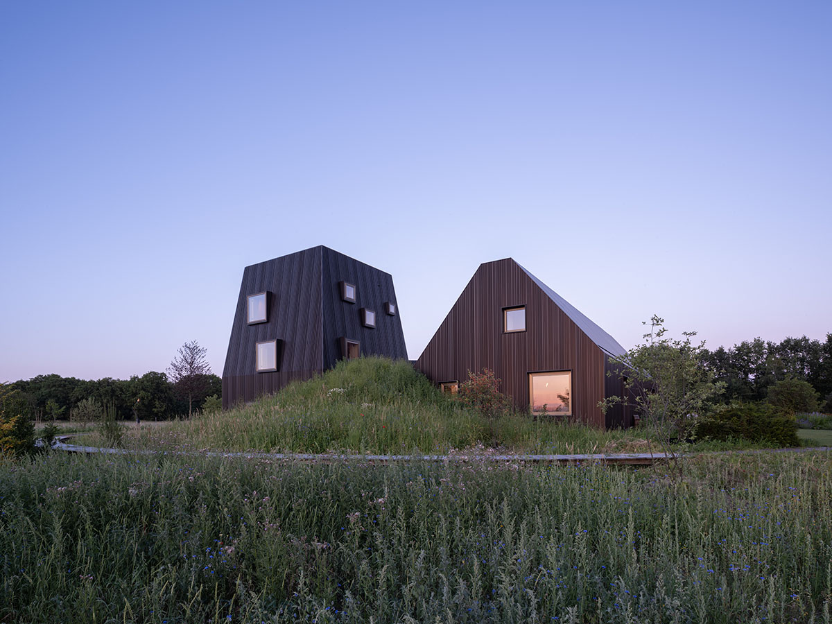 Mecanoo completes Villa Vught with dark bronze cladding inspired by traditional Dutch farmhouses