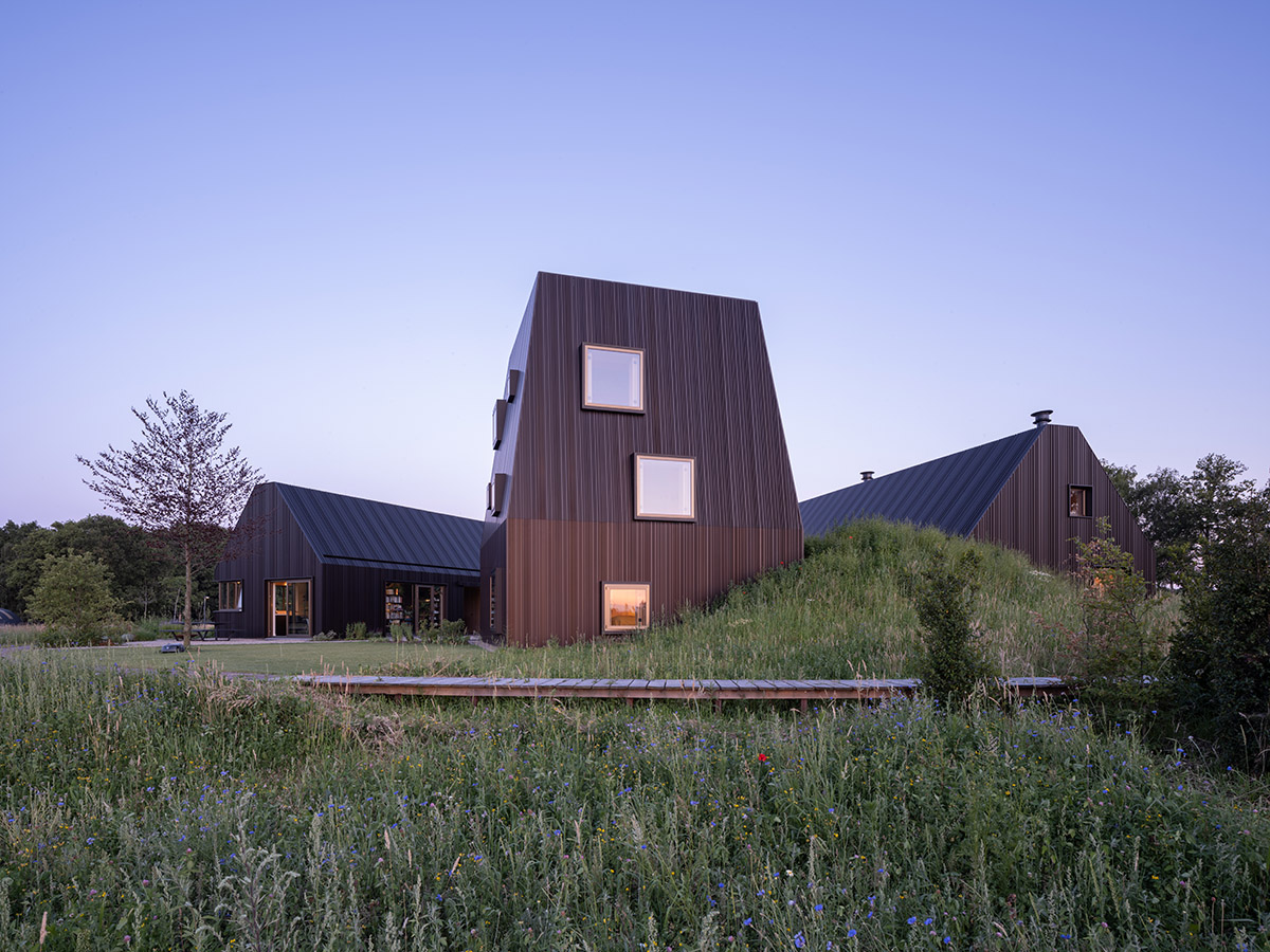 Mecanoo completes Villa Vught with dark bronze cladding inspired by traditional Dutch farmhouses