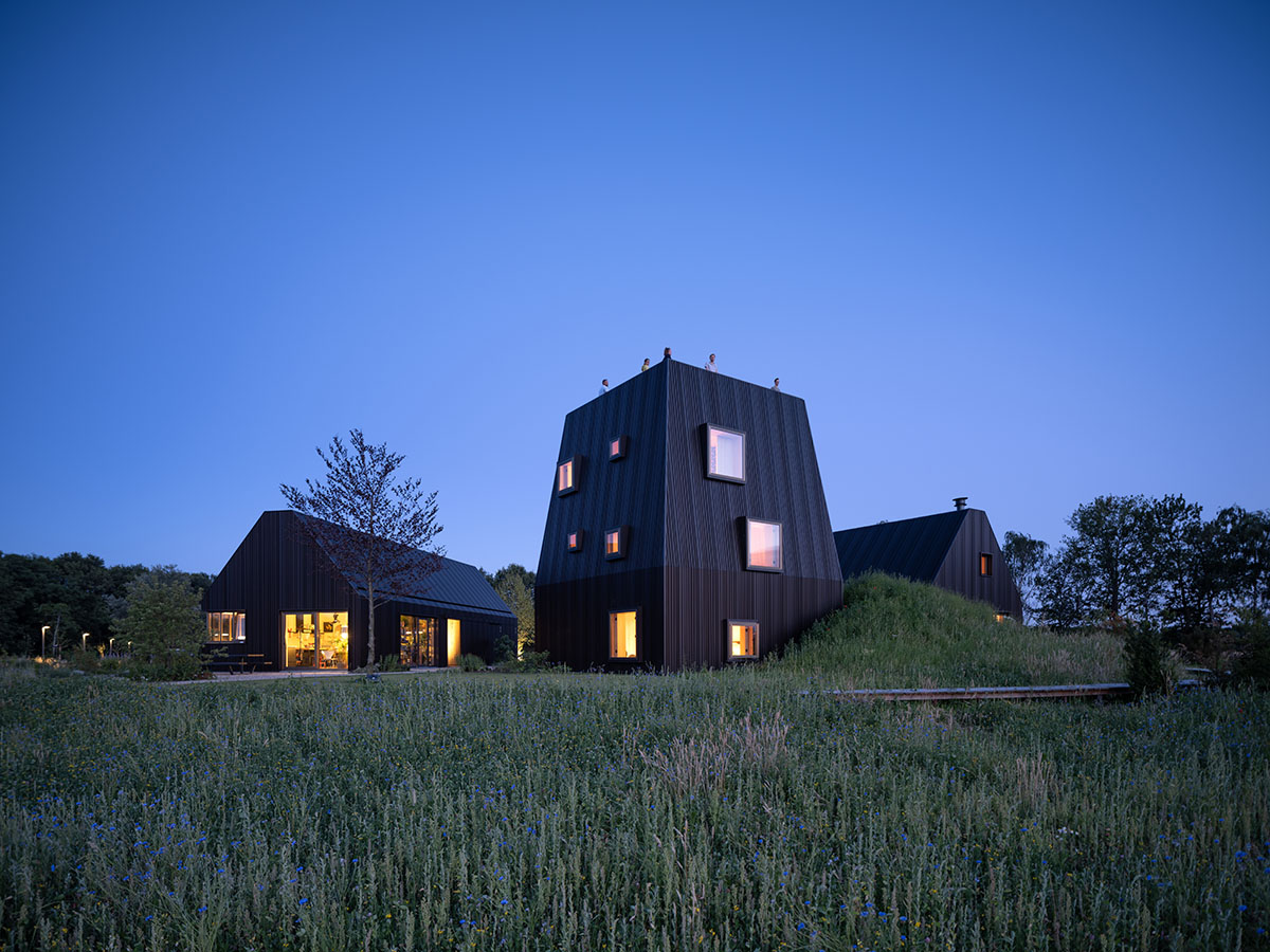 Mecanoo completes Villa Vught with dark bronze cladding inspired by traditional Dutch farmhouses