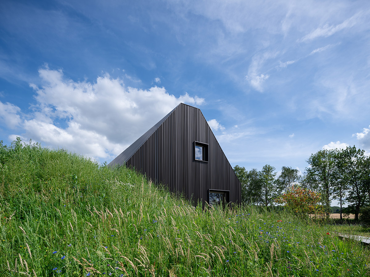 Mecanoo completes Villa Vught with dark bronze cladding inspired by traditional Dutch farmhouses