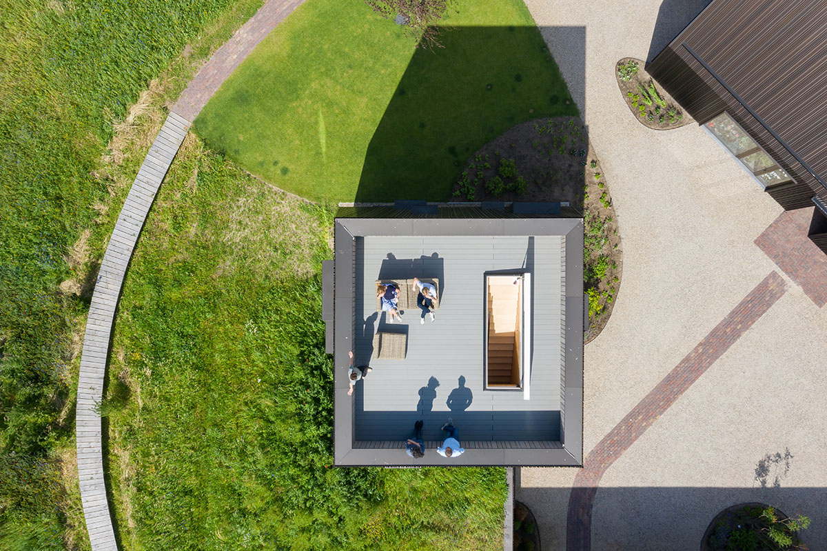 Mecanoo completes Villa Vught with dark bronze cladding inspired by traditional Dutch farmhouses