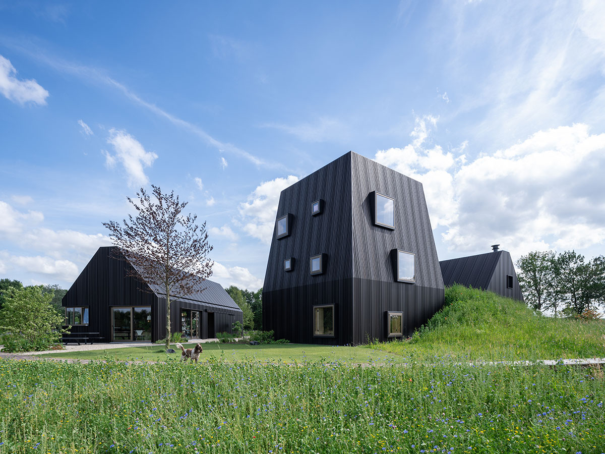 Mecanoo completes Villa Vught with dark bronze cladding inspired by traditional Dutch farmhouses