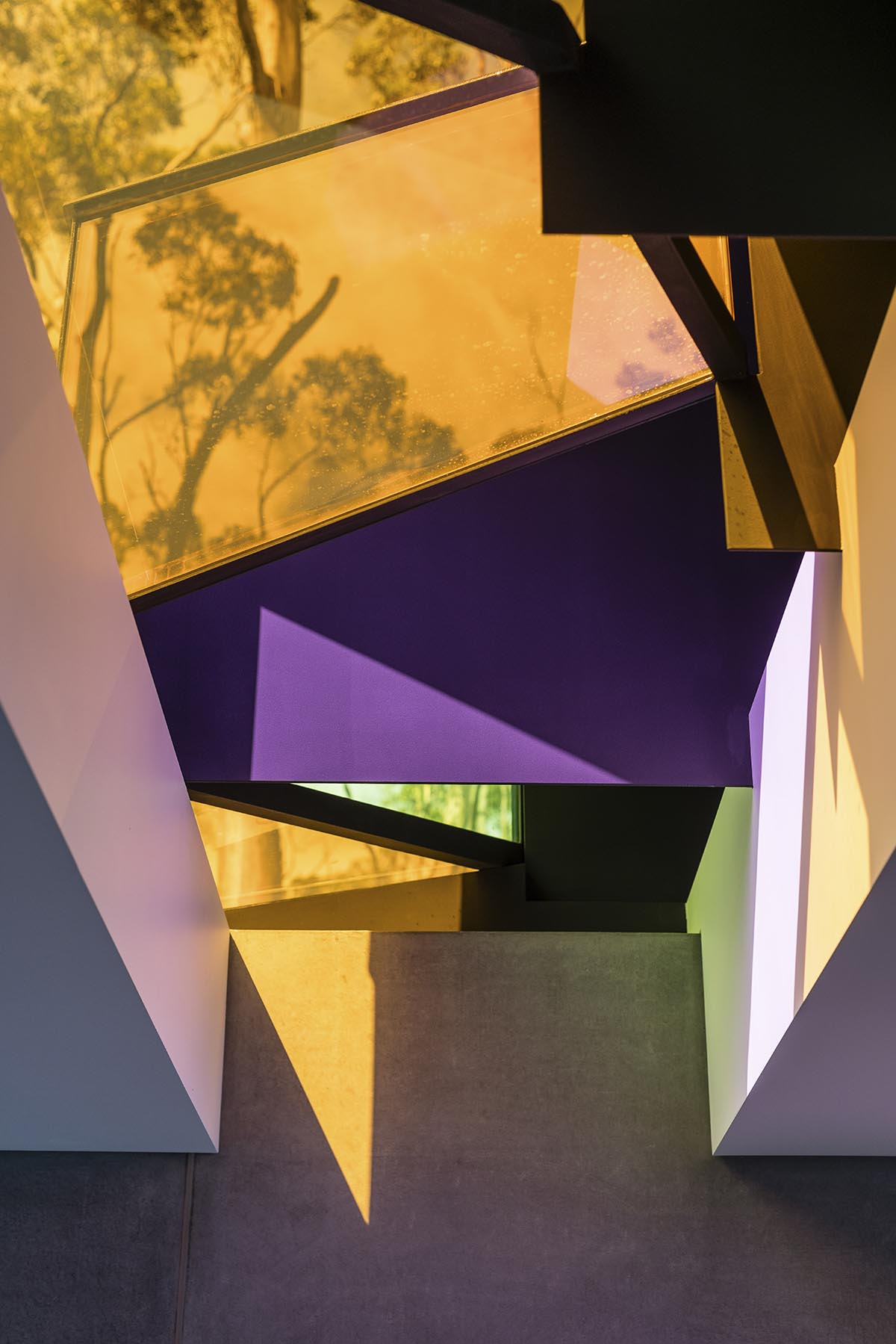 A linear, concrete tunnelled guest house by Room11 architects extends to Tasmania’s bushlands