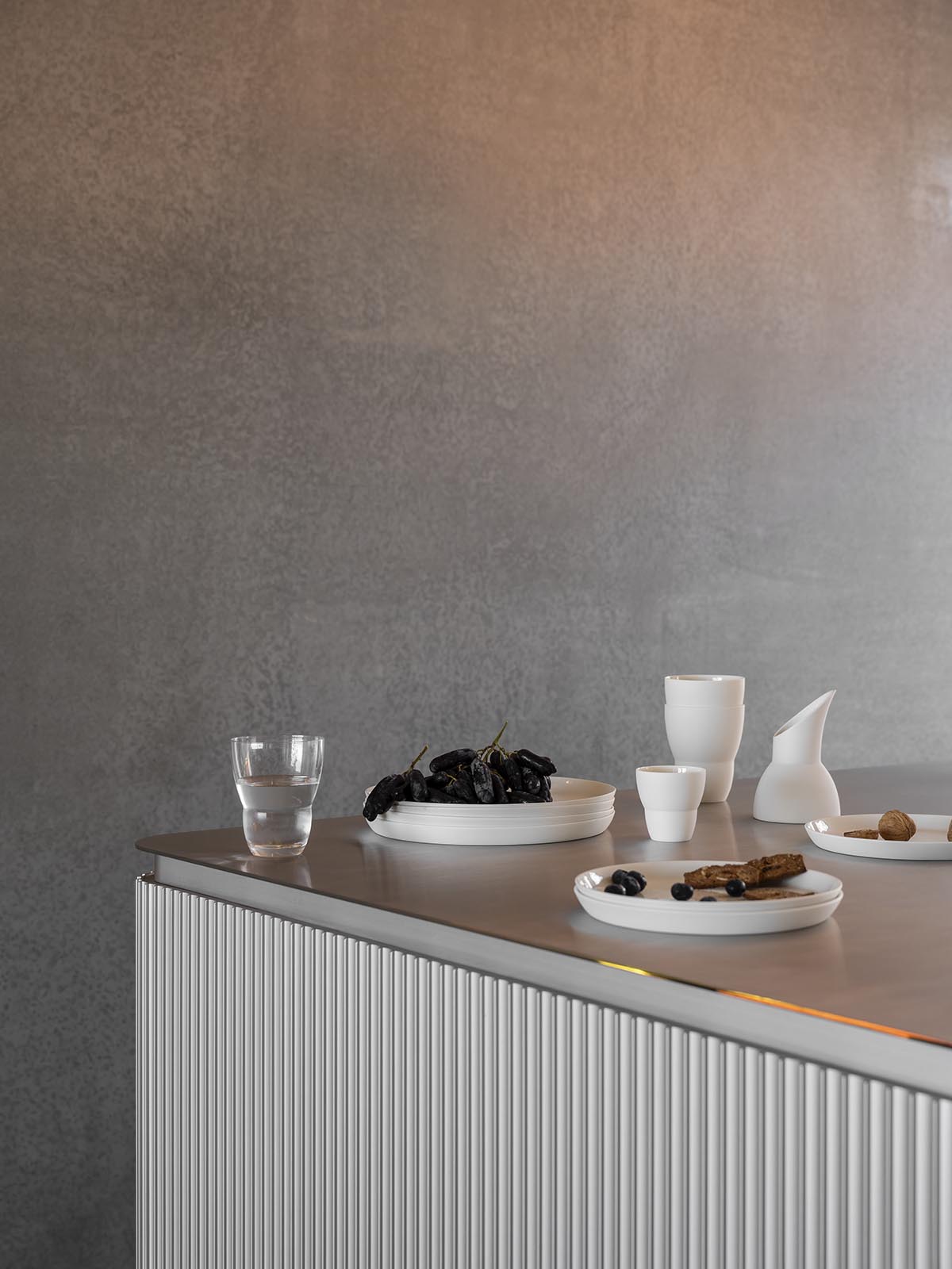 A linear, concrete tunnelled guest house by Room11 architects extends to Tasmania’s bushlands