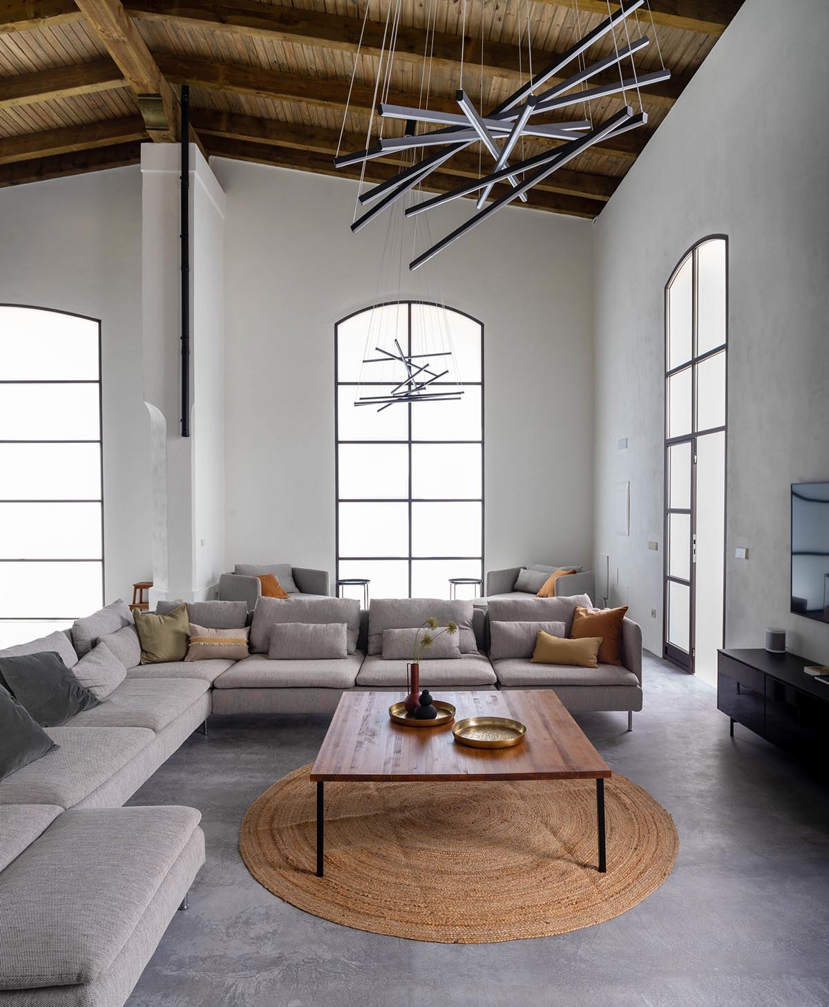 Iniesta Nowell Arquitectos converts old warehouse into house with a network of service alleys