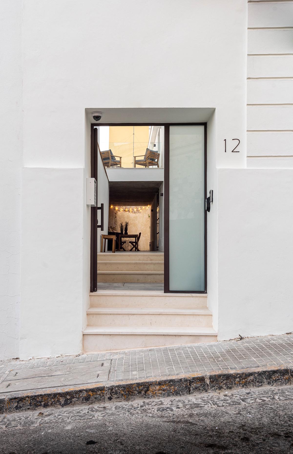 Iniesta Nowell Arquitectos converts old warehouse into house with a network of service alleys