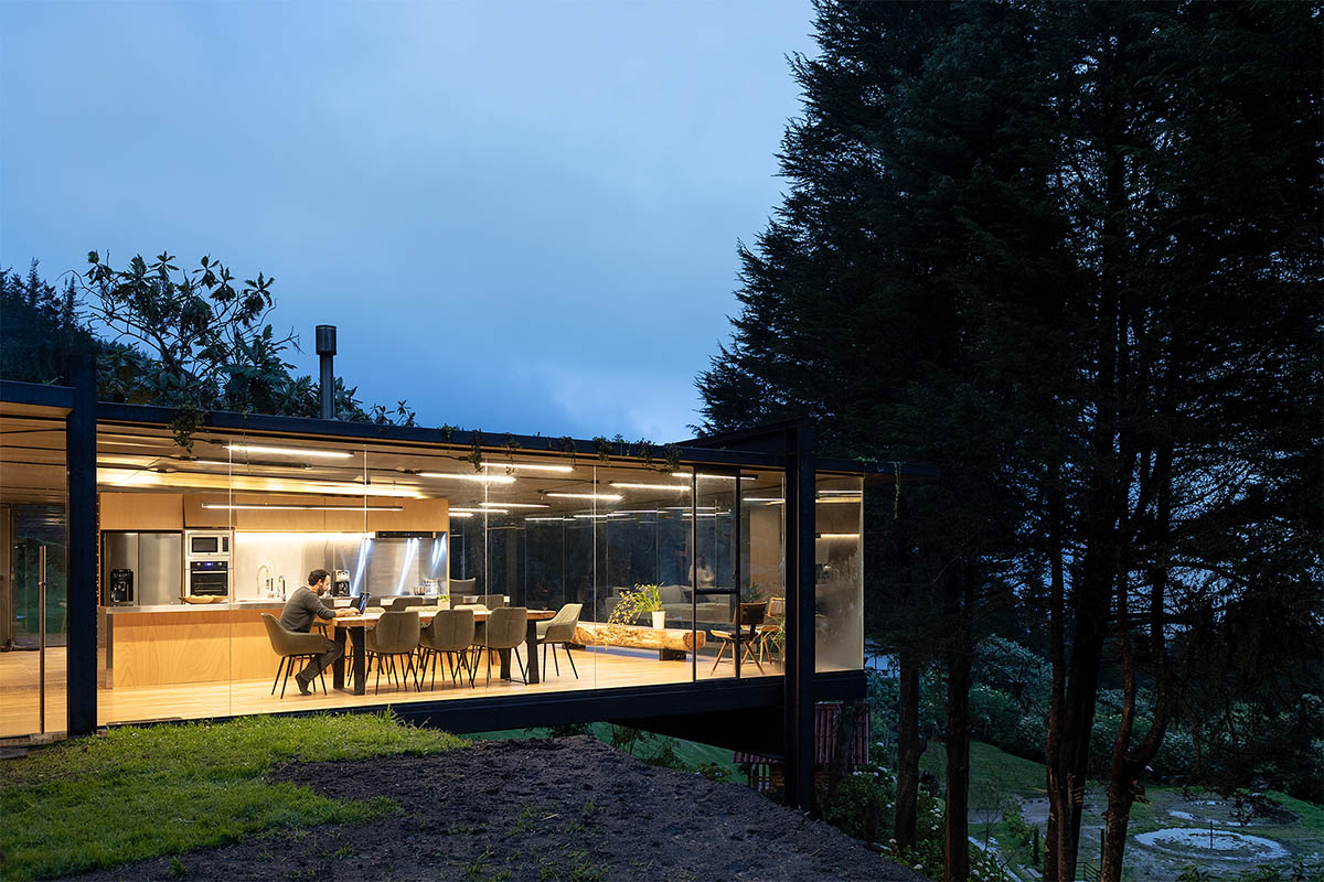 RAMA estudio built glazed retreat that sits on slope with minimal touch overlooking valley in Ecuador