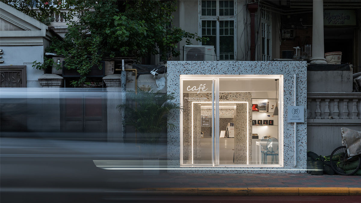 This tiny cafe by TOUCH Design is dotted with white and orange interwoven terrazzo details in Tianjin