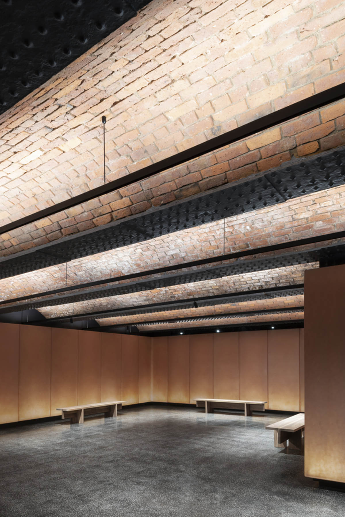 Carmody Groarke completes gallery that features brick vaulted ceilings and back-lit panels