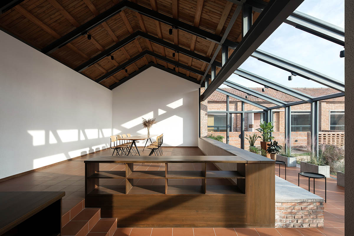 REDe Architects and Moguang Studio add red circular platform to renovated youth activity center