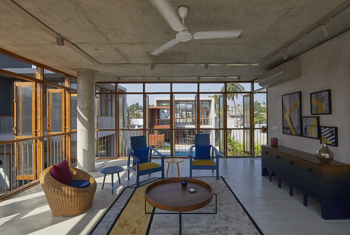 12-foot-tall weathered steel wall ensures privacy and noise-free house in India by Abin Design Studio