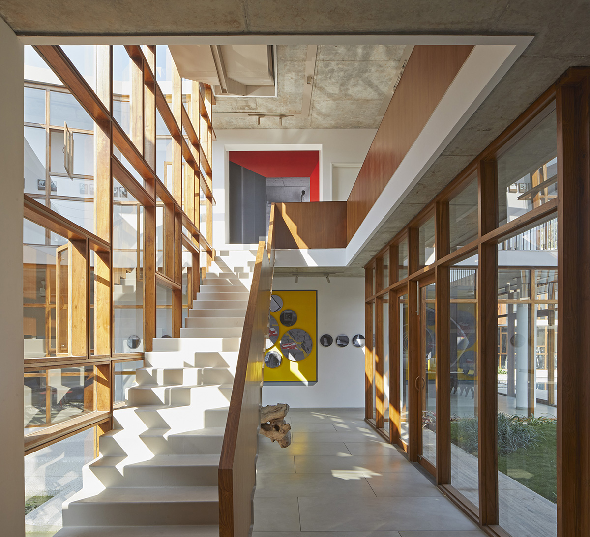 12-foot-tall weathered steel wall ensures privacy and noise-free house in India by Abin Design Studio