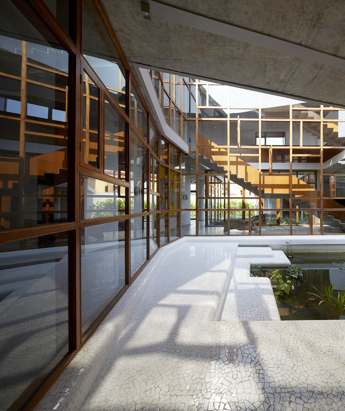 12-foot-tall weathered steel wall ensures privacy and noise-free house in India by Abin Design Studio