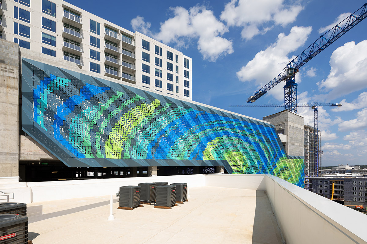 THEVERYMANY designed a dynamic and porous skin that wraps the facade of a garage in North Carolina