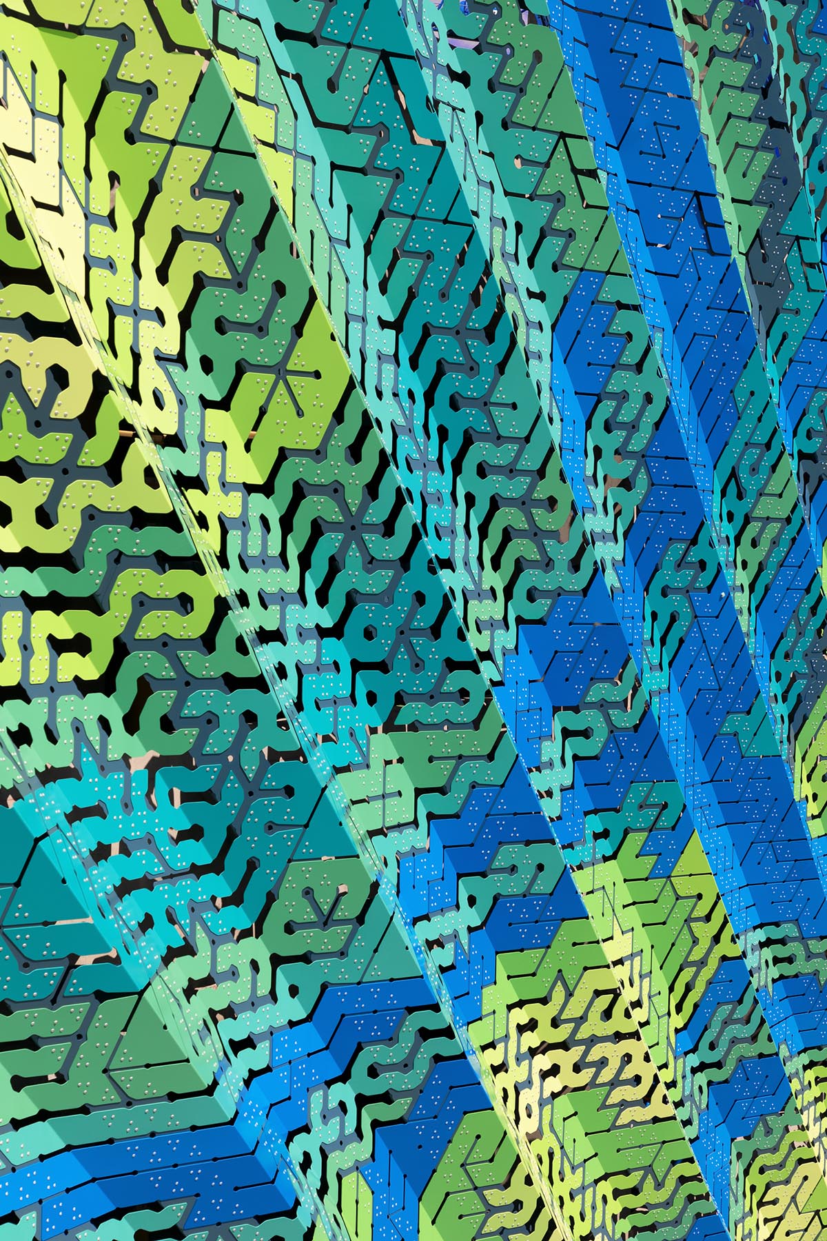 THEVERYMANY designed a dynamic and porous skin that wraps the facade of a garage in North Carolina