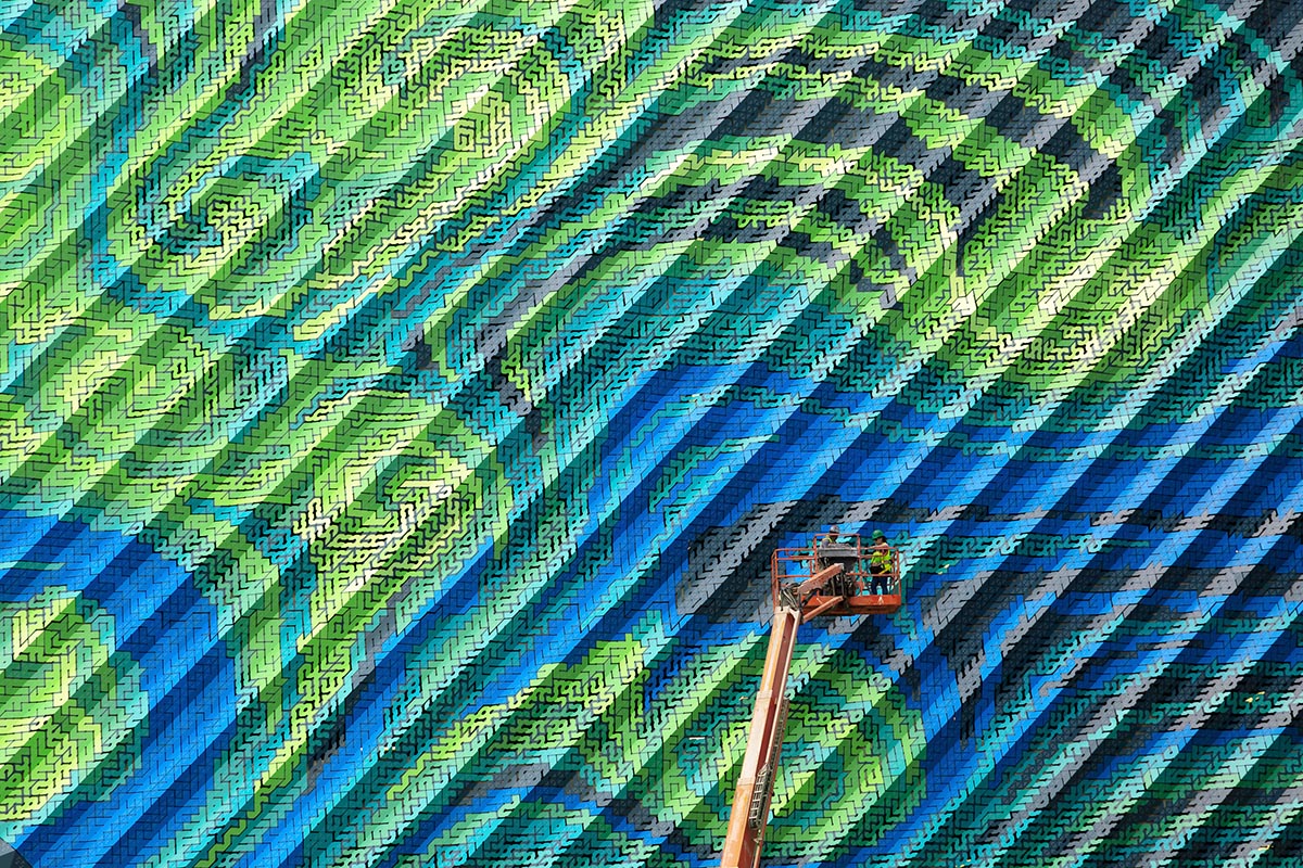THEVERYMANY designed a dynamic and porous skin that wraps the facade of a garage in North Carolina