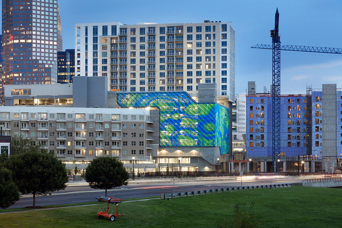 THEVERYMANY designed a dynamic and porous skin that wraps the facade of a garage in North Carolina