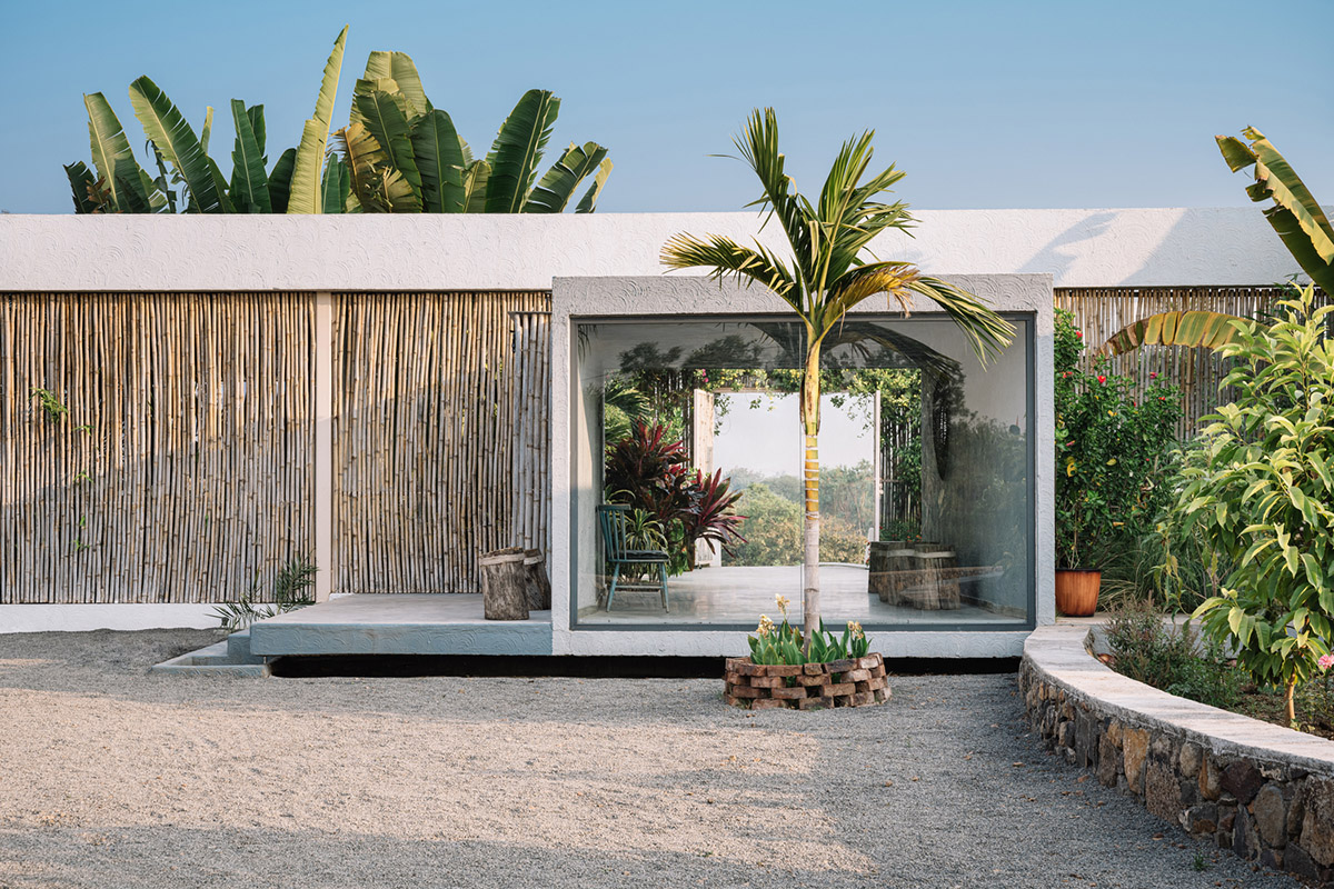 Weekend home is clad in bamboo screens that create a rustic appearance on the outskirts of Pune