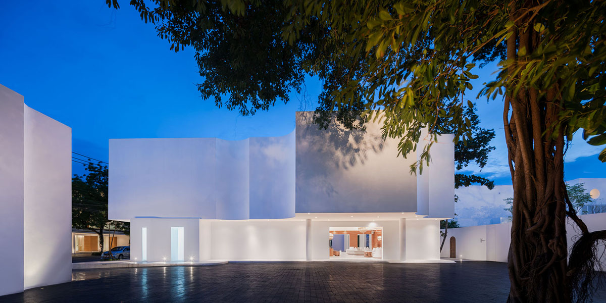 onion combines white concave and convex walls with colorful surfaces for beach resort in Thailand